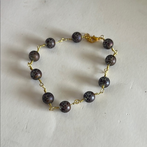Gold and Black Bracelet with Elegant Bead Design - Picture 1 of 6
